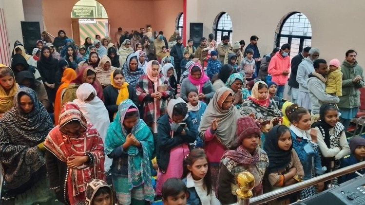 A congregation of people worshipping